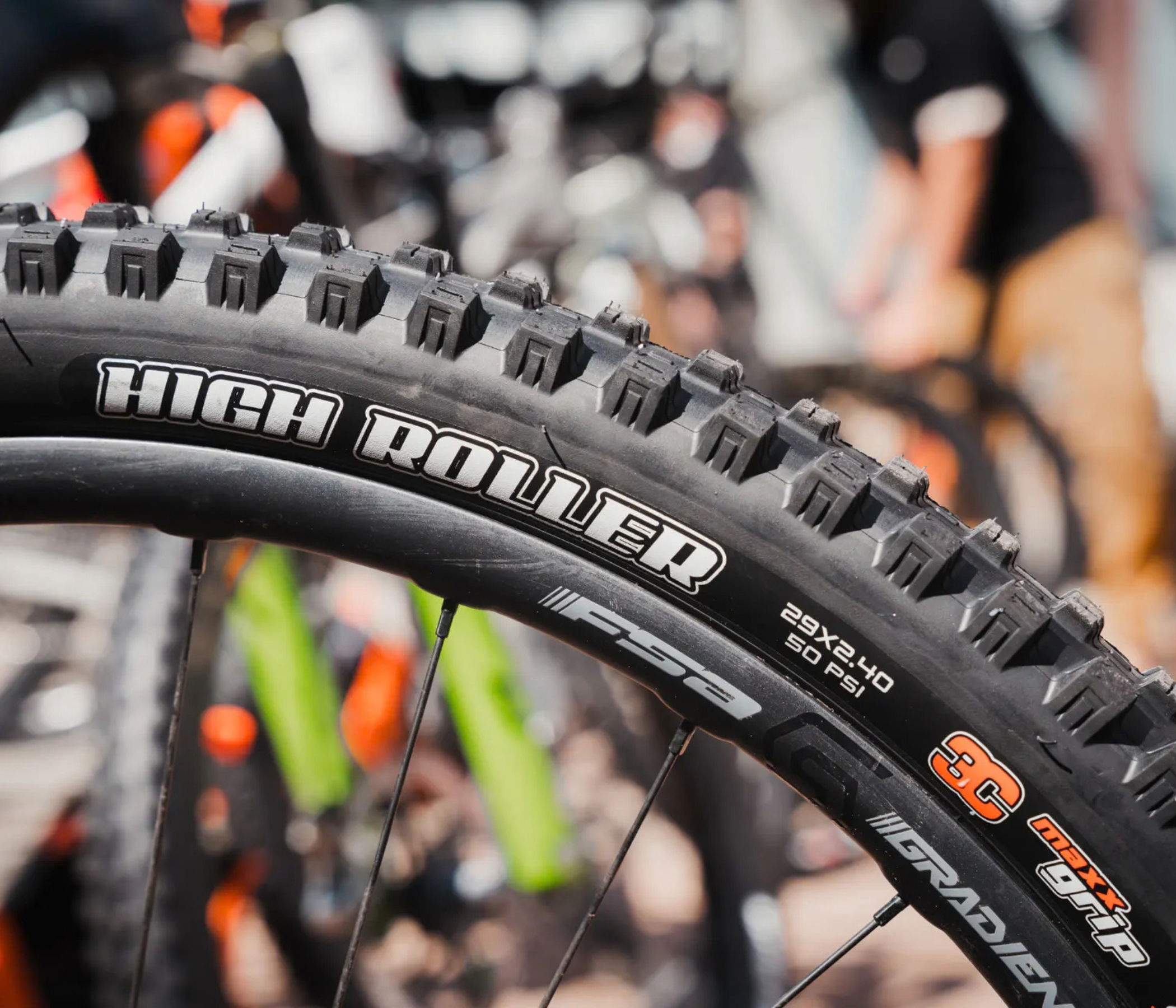 Close-up of a mountain bike tire with visible tread pattern and branding.