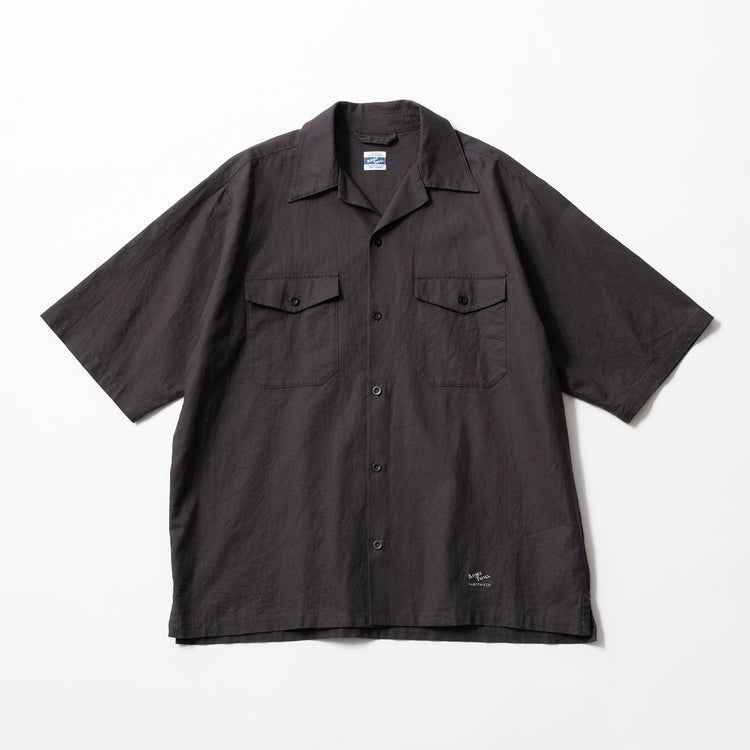 Black short-sleeve shirt with two front pockets.