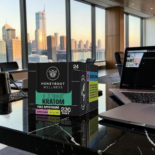 A box of Kratom on a table with a city skyline view.