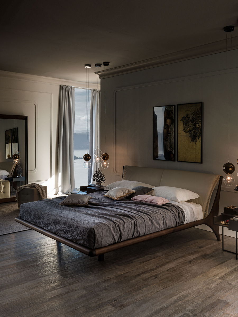 Modern Cattelan Italia bedroom with a large Nelson bed, artwork, and natural light.