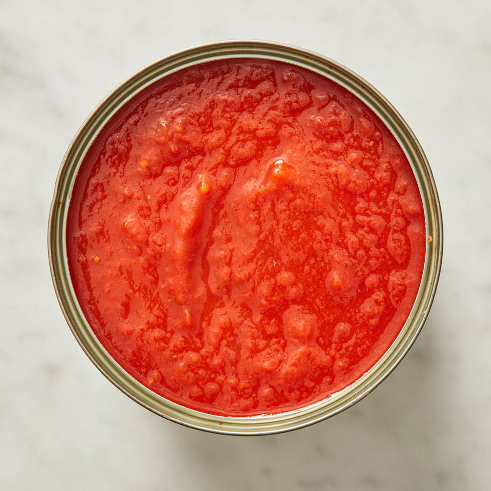 Downshot of an open can of DeLallo Tomato Sauce