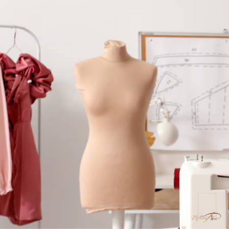 Pink dress form in a sewing room