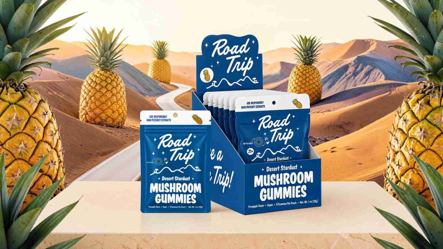 Mushroom gummies displayed in a tropical setting with pineapples and mountains.