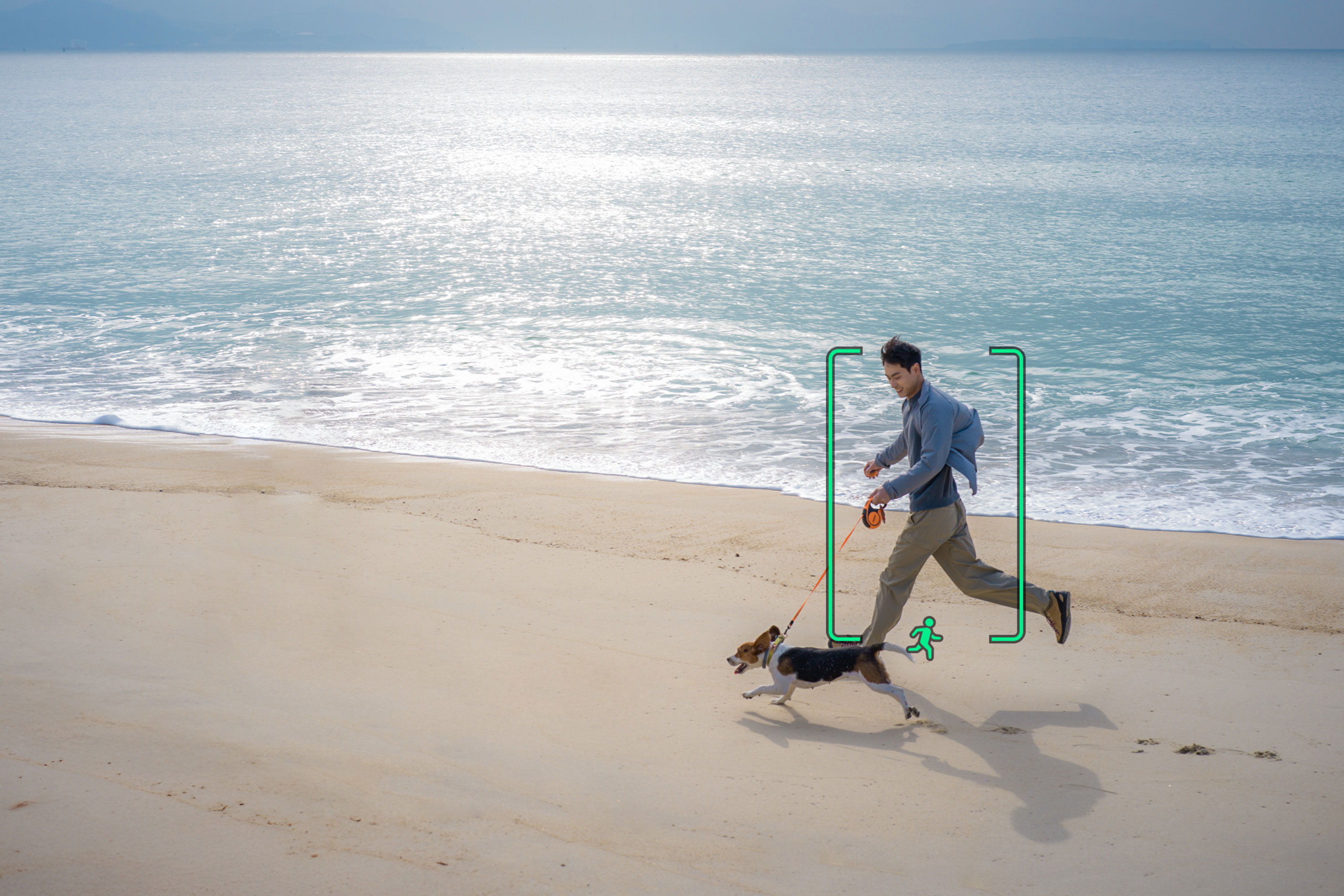DJI Lito 1 records a person running on the beach with a dog.