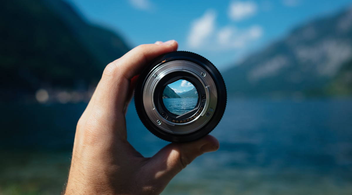 person holding camera lense focusing on nature|glutamic acid benefit focus memeory