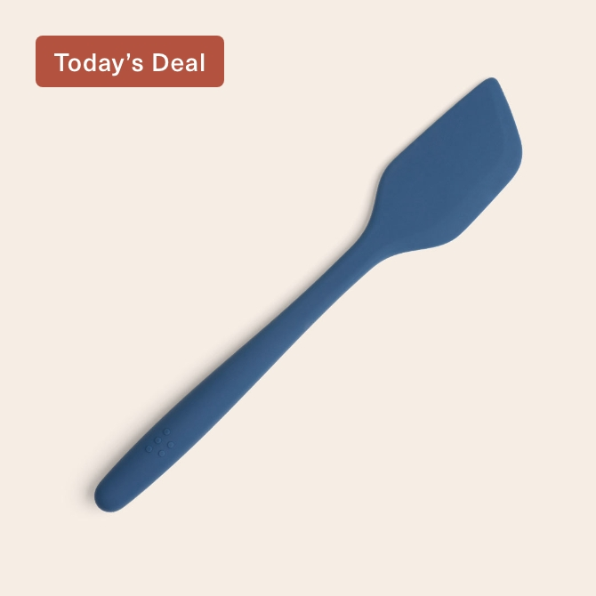 A blue Misen Silicone Spatula seen from above, with raised Misen logo visible on its ergonomic handle.