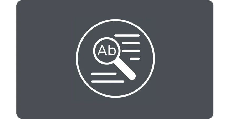 Magnifying glass over text, representing search or analysis of written content.