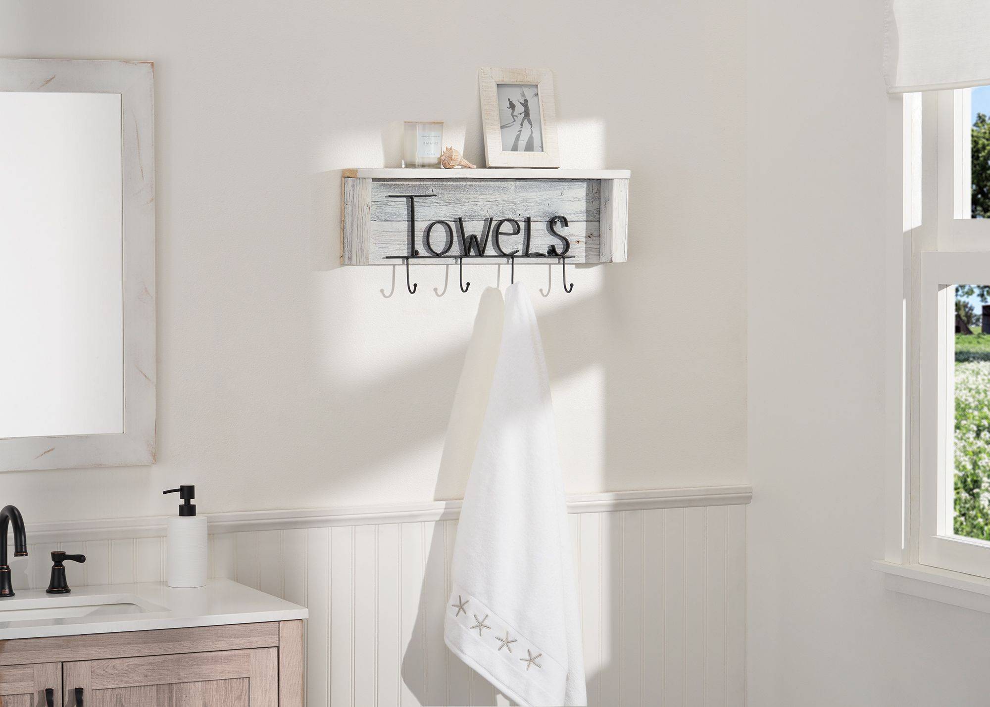 white bathroom towel rack with shelf