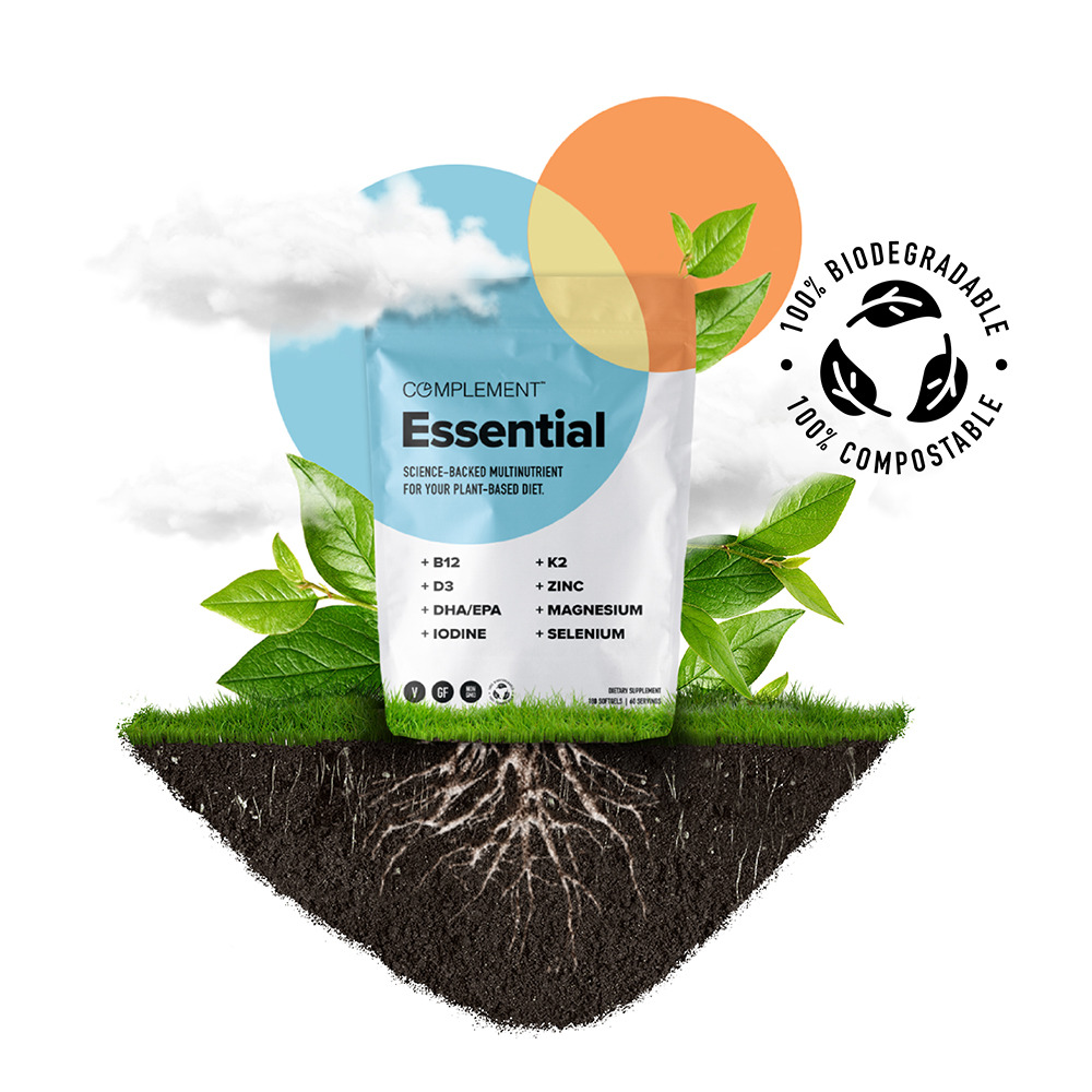 Biodegradable and compostable Complement Essential vegan multivitamin pouch growing into the earth. 