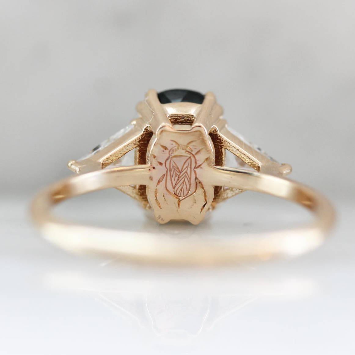 green sapphire ring with bee engraving