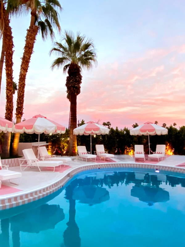 Boxhill's custom pink and white pool umbrellas line the pool deck at the Trixie Motel in Palm Springs.