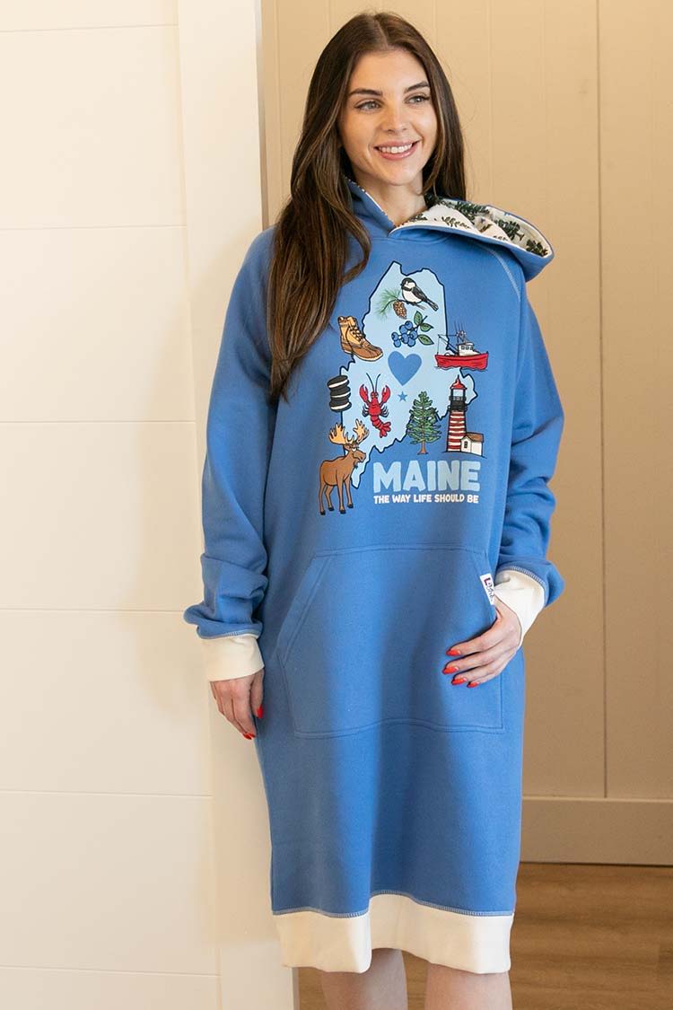 Woman wearing a blue hoodie dress with Maine-themed designs.