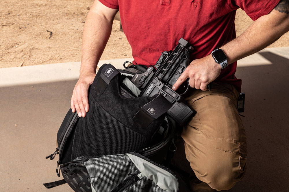 gear and body armor in backpack.