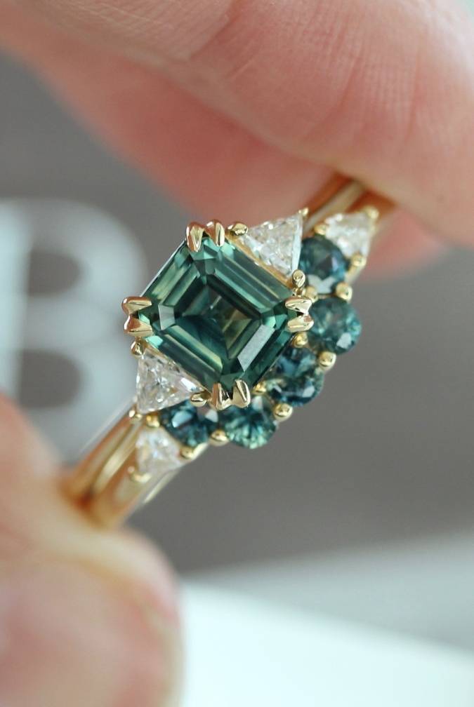 Emerald Cut Sapphire Ring With Trillion Diamond Side Stones