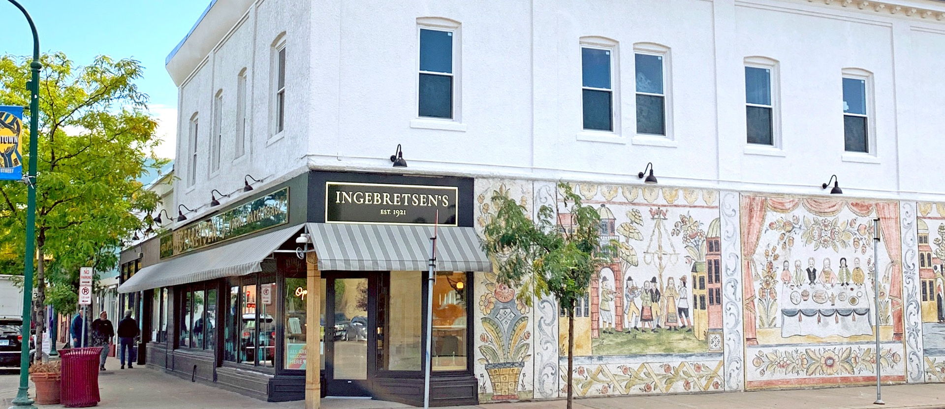 Ingebretsen’s Nordic Marketplace storefront on East Lake Street in Minneapolis, showcasing a welcoming entrance with Scandinavian-themed signage and window displays.