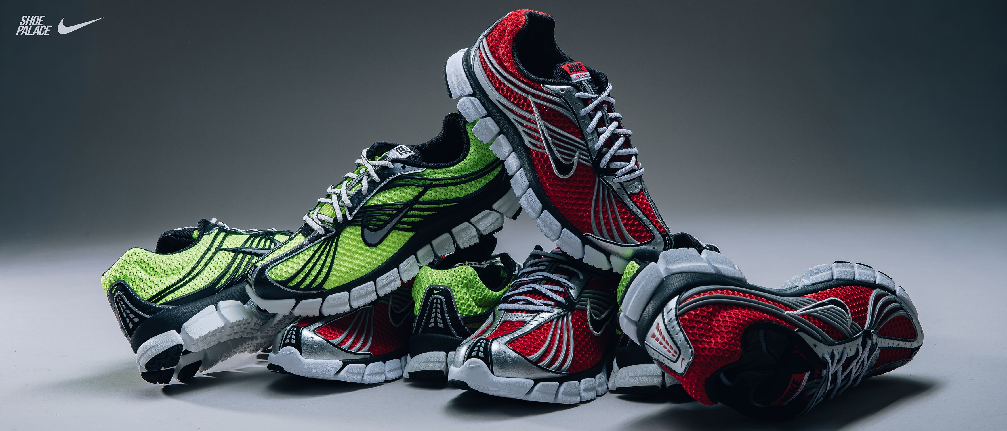 A collection of colorful Nike running shoes stacked together.