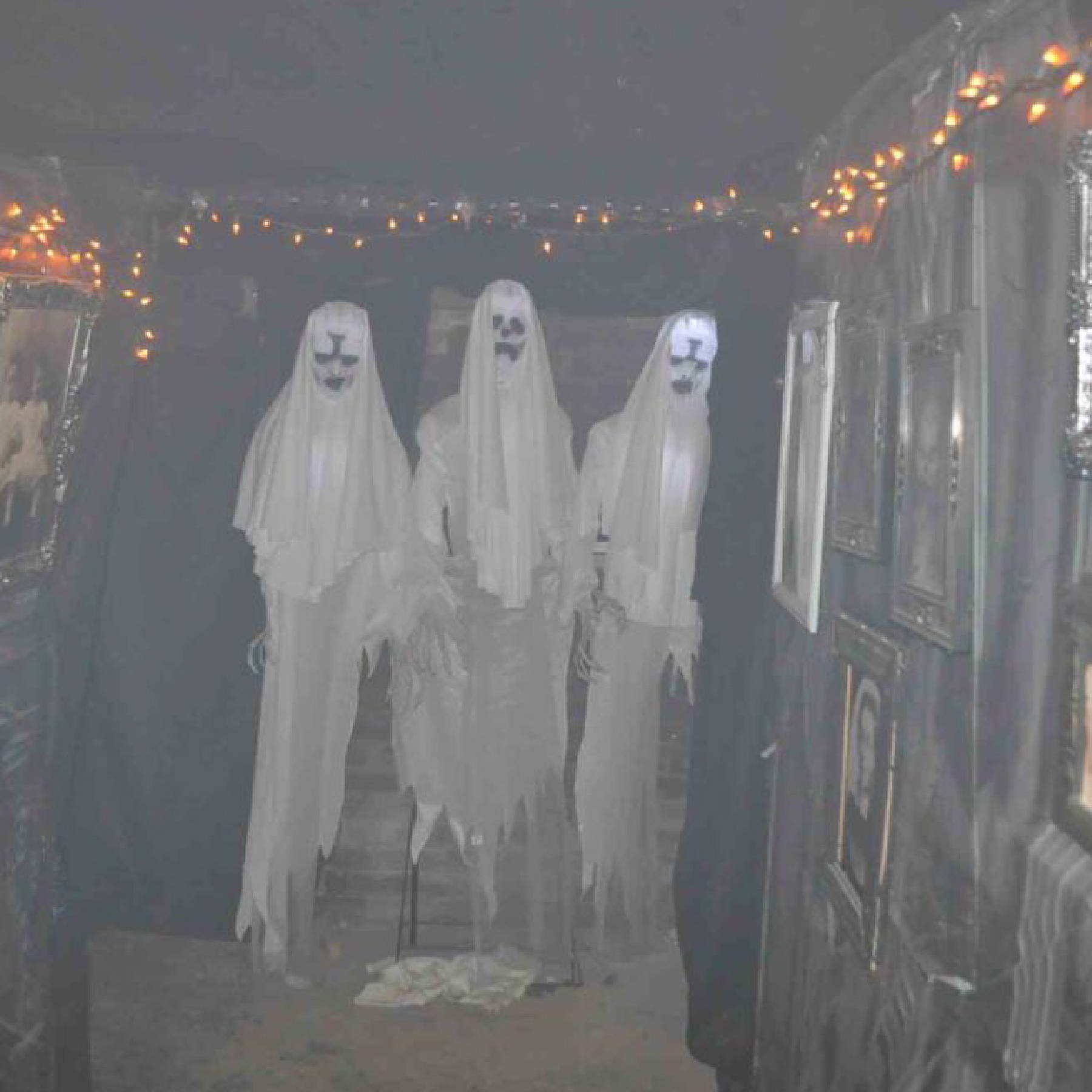 a group of people dressed in white ghost clothing