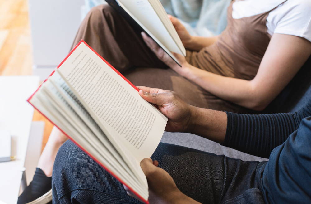 2 people sitting down reading books|keep learning to keep mind mentally strong and brain healthyd 