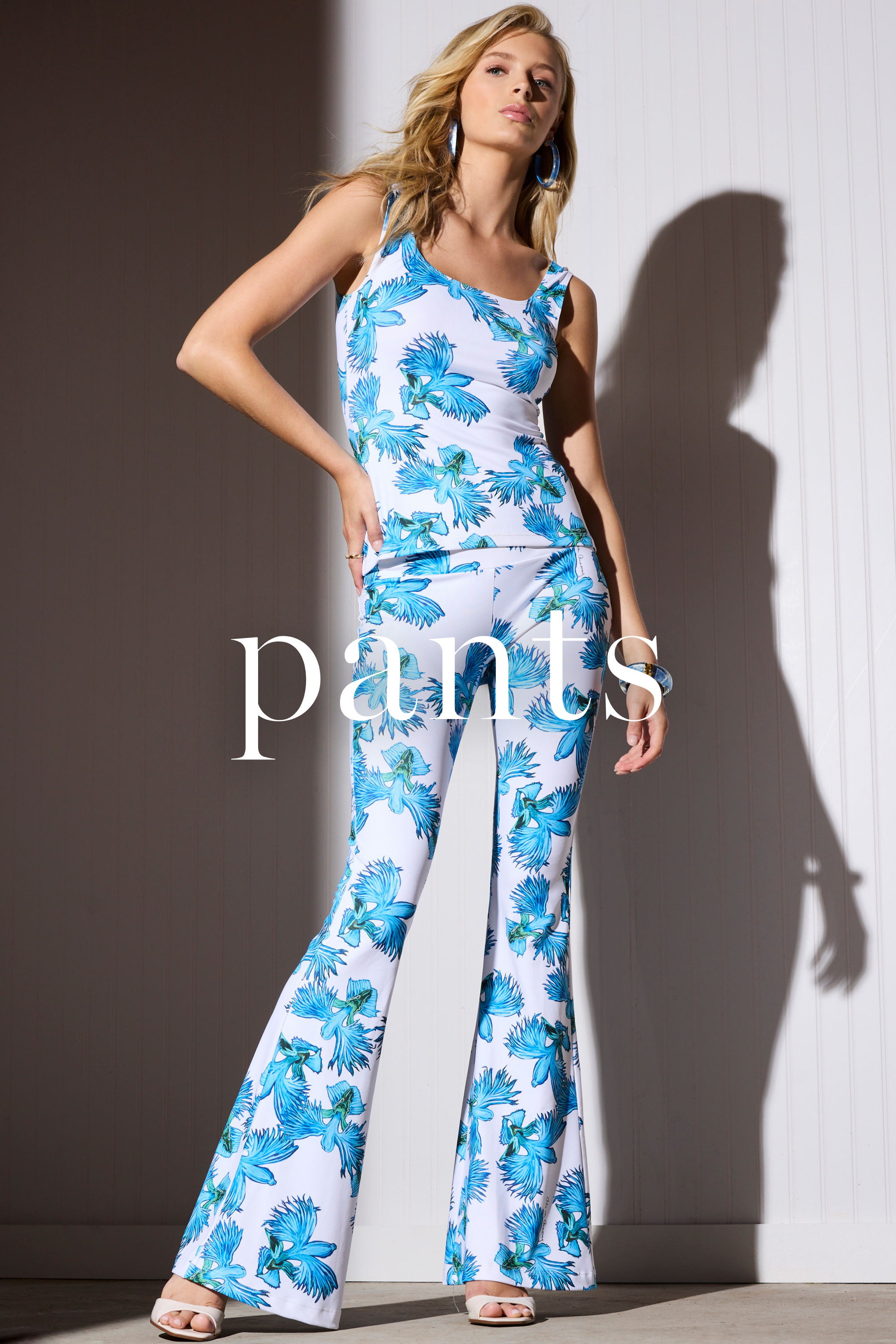 Model wearing floral patterned outfit with text 