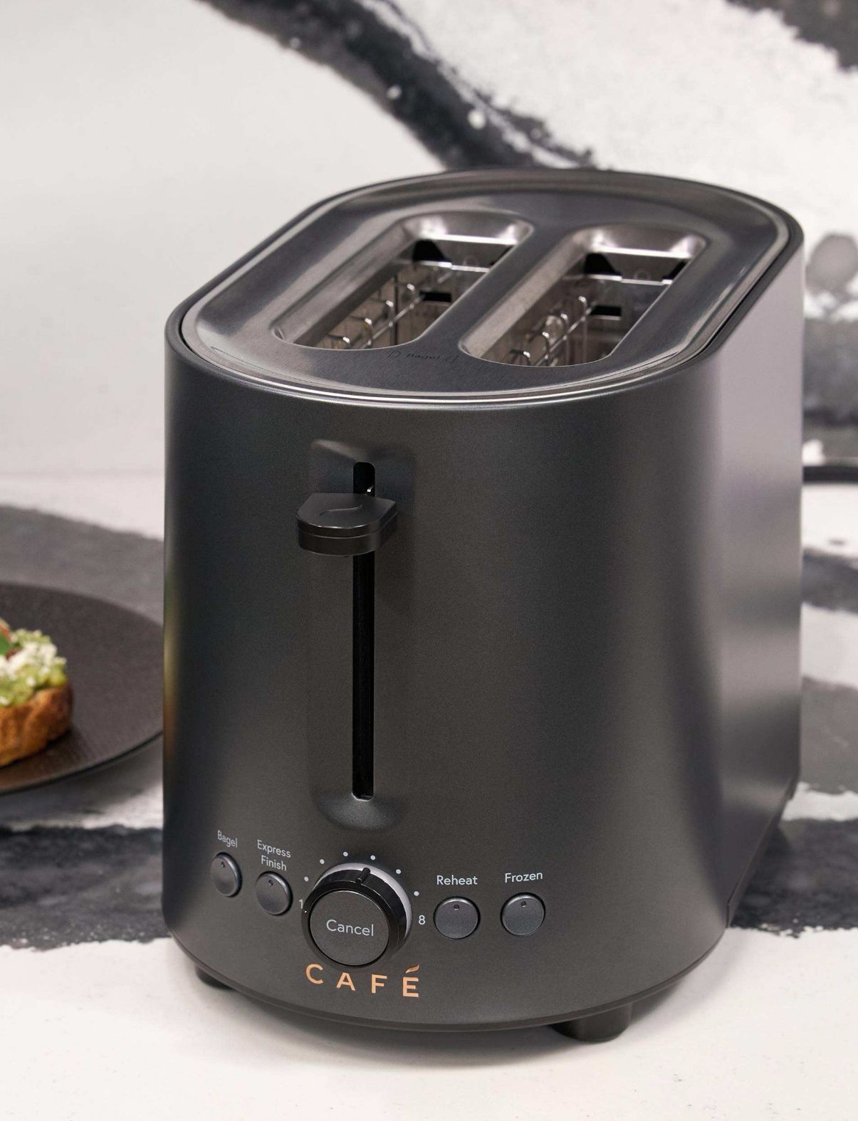 A sleek black toaster with two slots and control buttons.