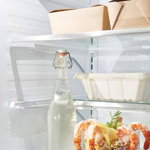 leftovers on top shelf in refrigerator