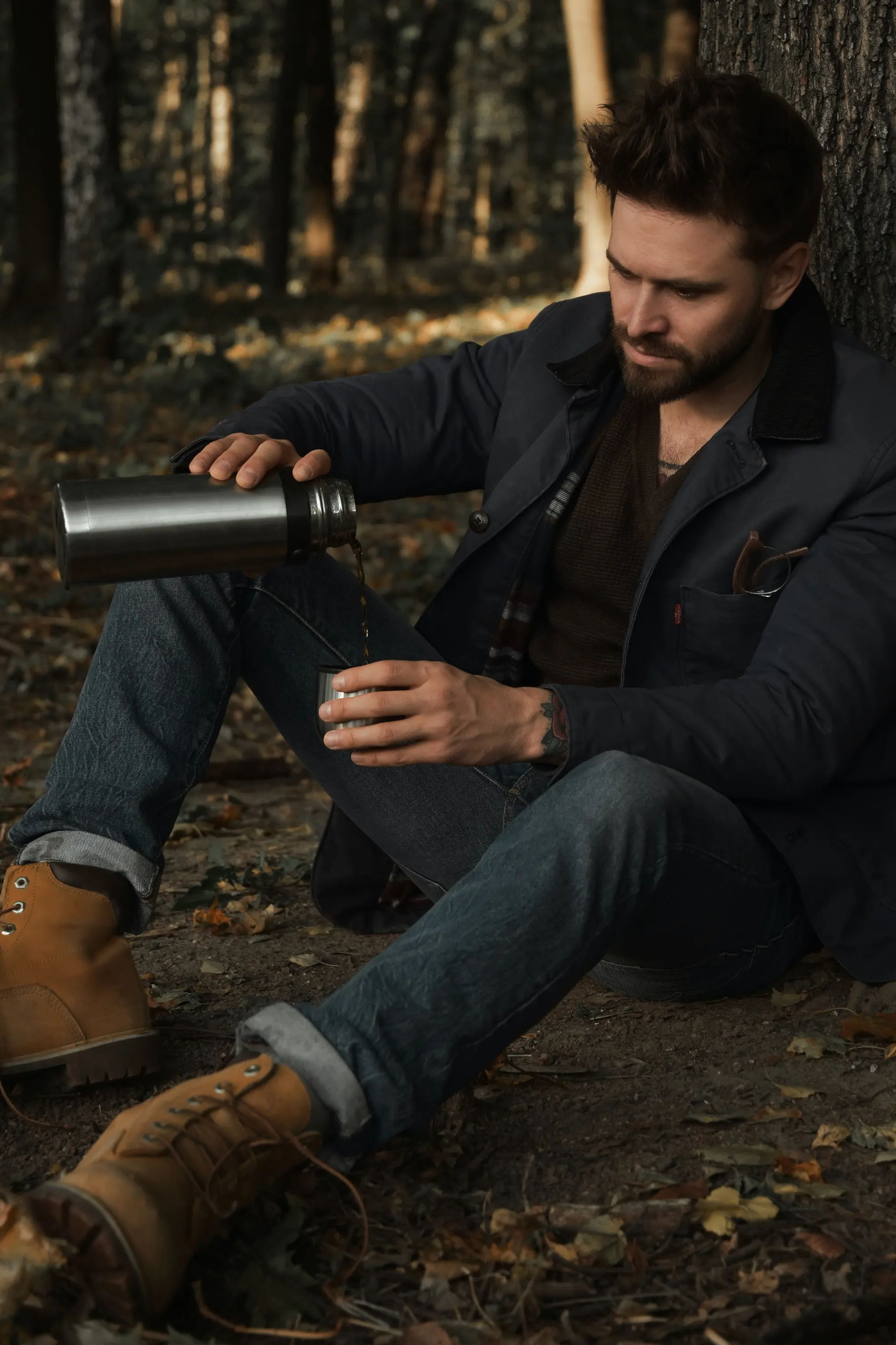 Image of a man sitting in the woods