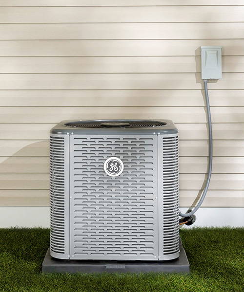 Image of GE Residential HVAC Single Stage Air Conditioner, installed outside of a home