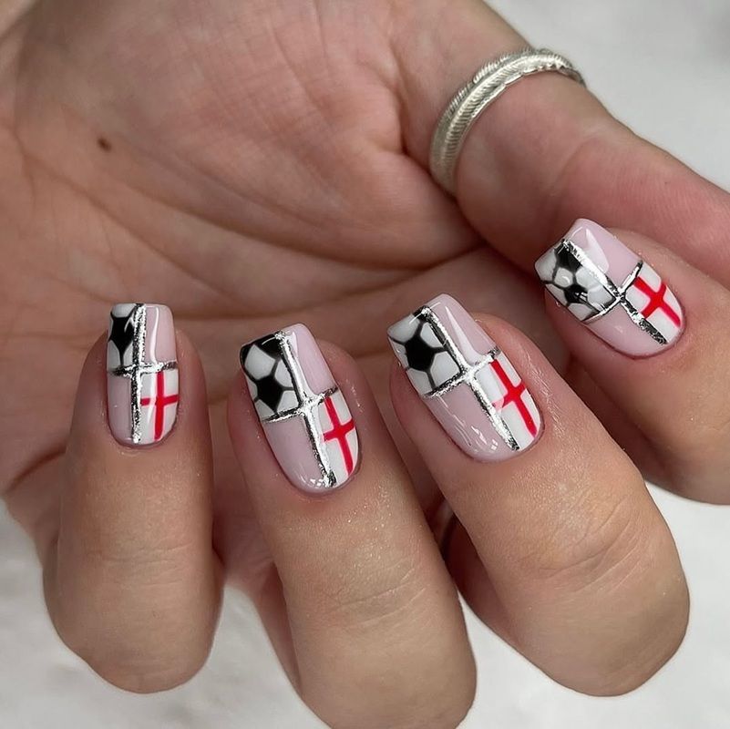 Nail art featuring soccer themes and the England flag design.