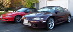 Front three-quarter maroon 1999 Mitsubishi Eclipse front-mount intercooler driveway red Eclipse Shocker XL train horn featured customer install gallery photo 1