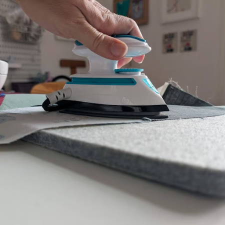 pressing quilt pieces on wool pressing mat