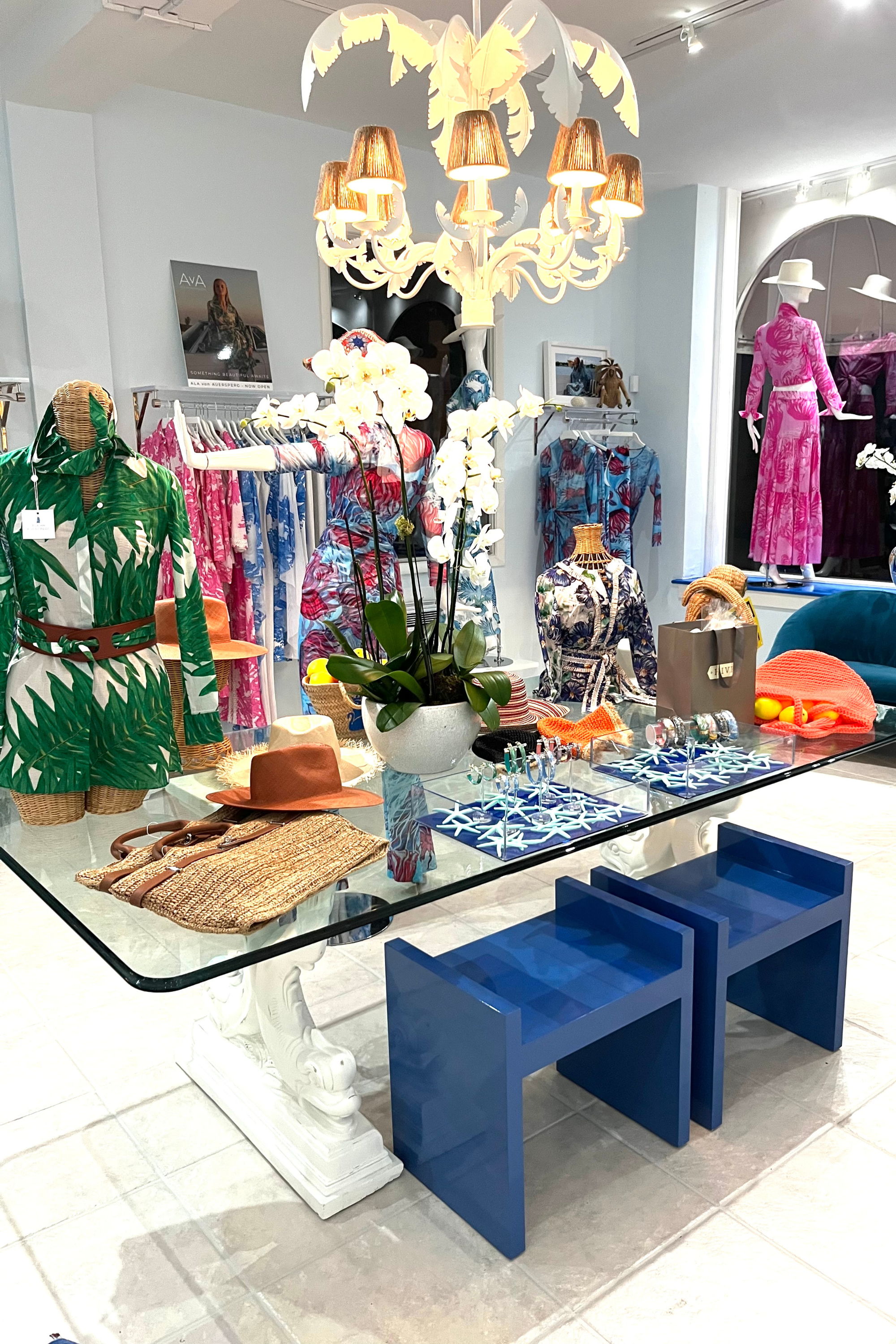 Display of colorful clothing and accessories in a stylish retail store.