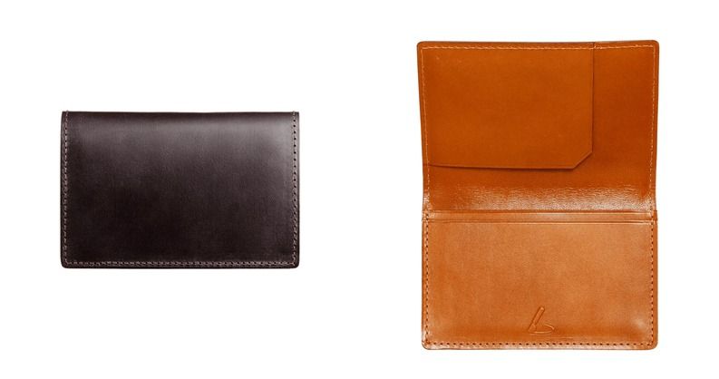 Two leather wallets, one closed and one open, showing inner pocket.