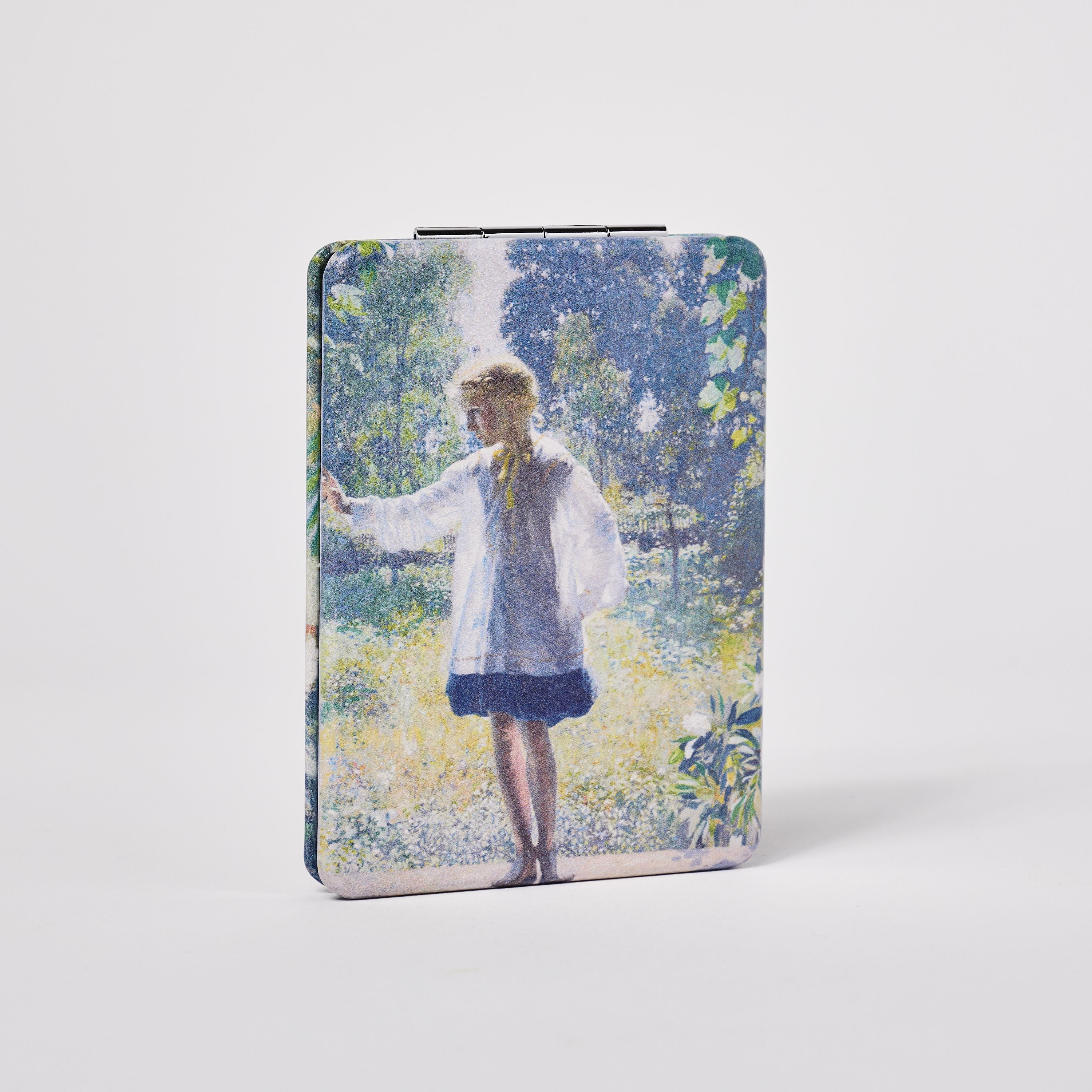 A girl in a white dress stands in a colorful, nature-filled background.