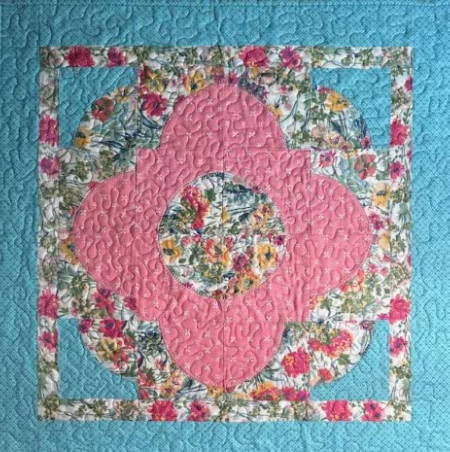 Love Ring Quilted Wall Hanging with pink, blue and floral fabrics