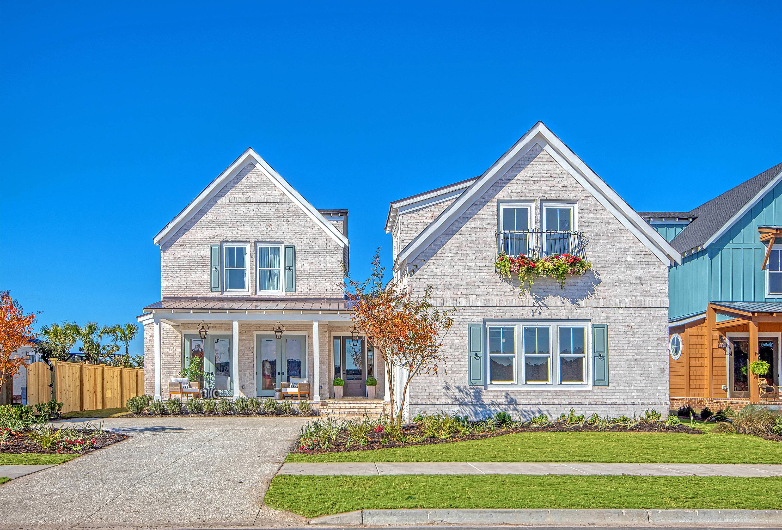 Home exterior with window boxes, planters, and architectural accents