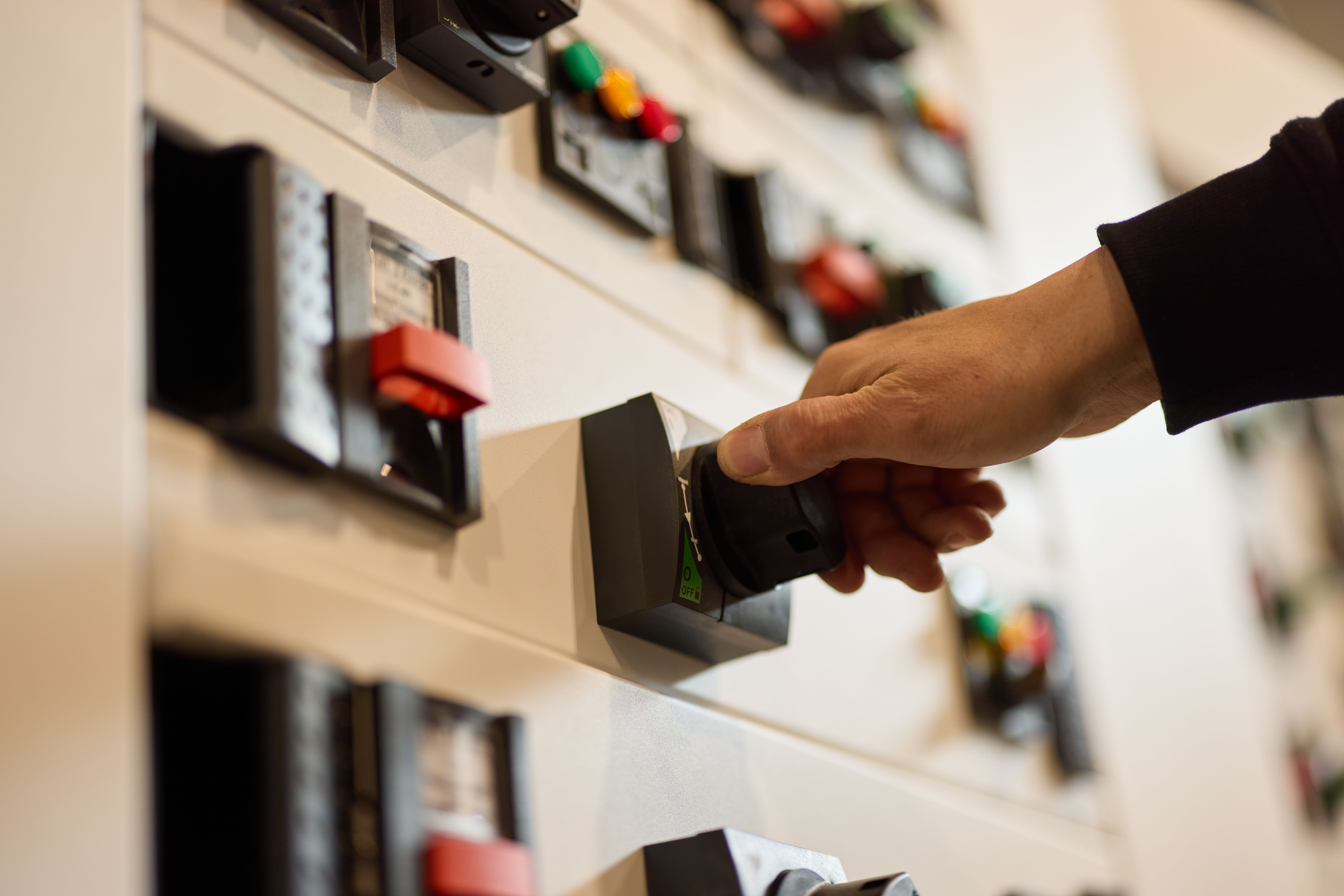 Manual switches, levers and buttons on a control panel