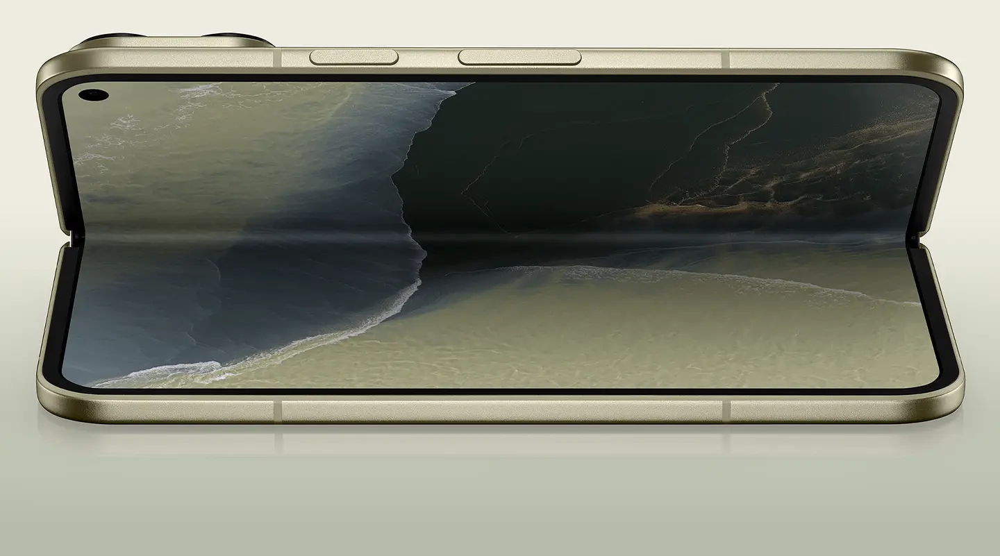A foldable smartphone displaying a scenic landscape on its screen.