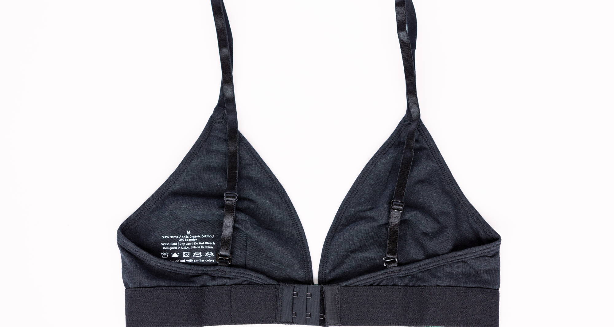 The back of a black triangle bralette sowing the clasp