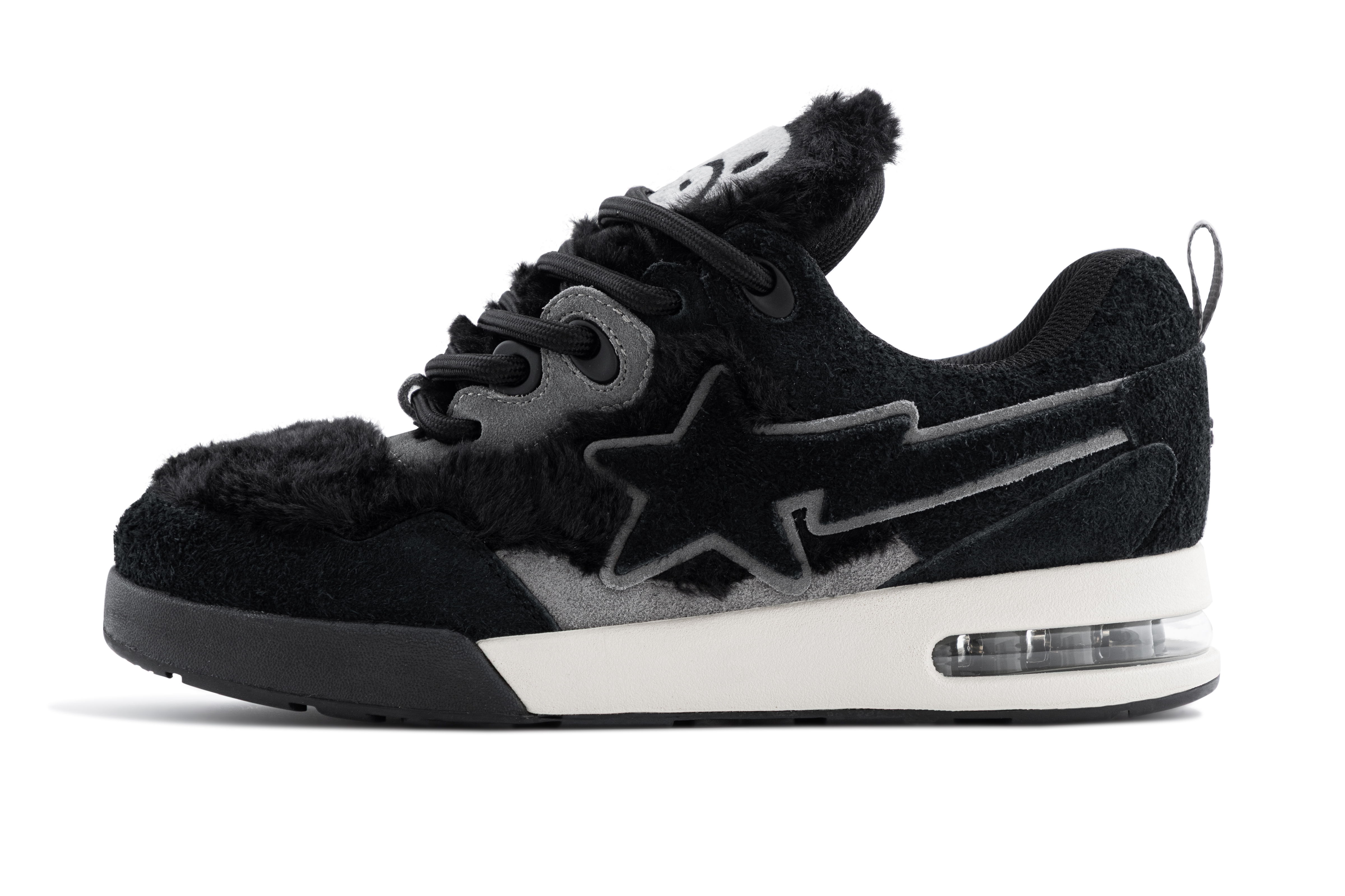 Black sneakers with a star design and air cushioning.