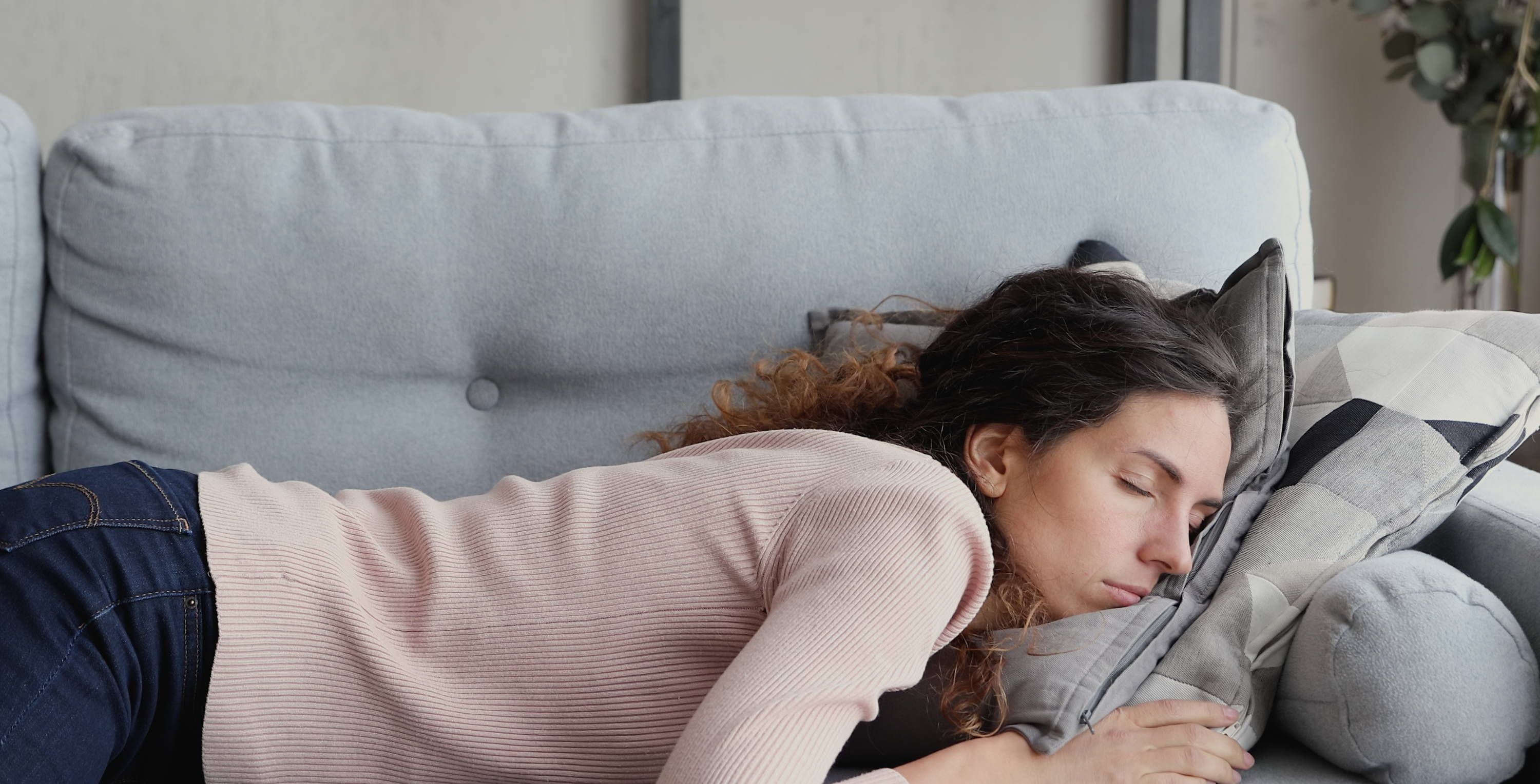 Woman asleep on sofa