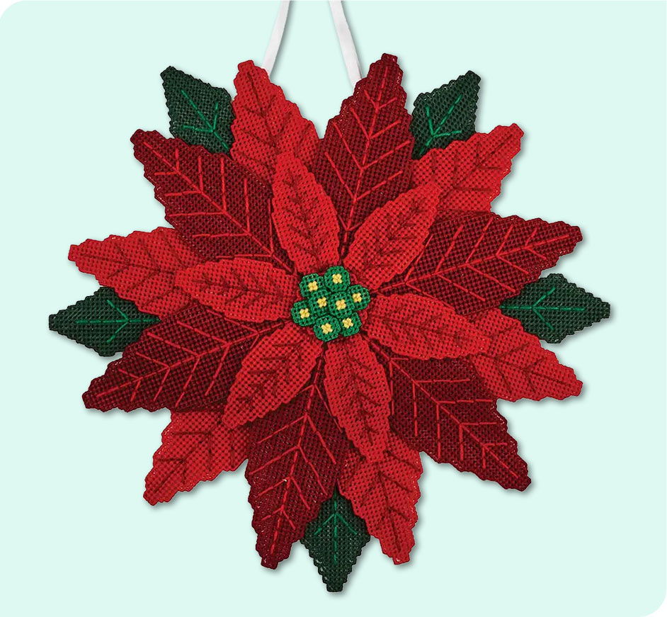 Red and green poinsettia decoration with leaves and central flower.
