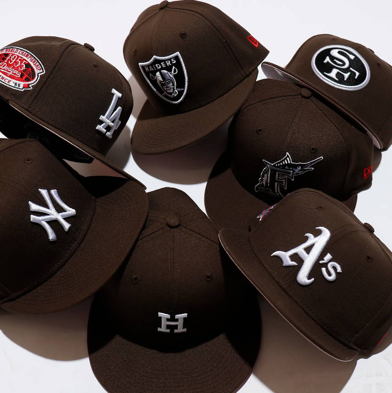 brown new era hats scattered