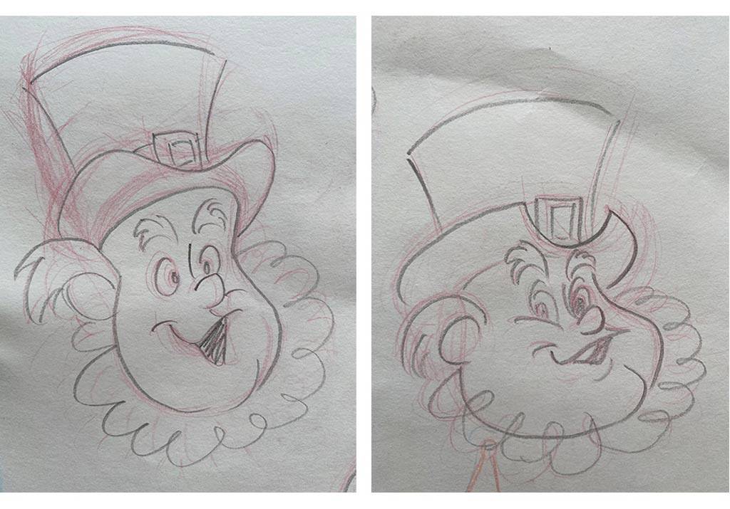 Sketches of leprechaun character head in red and black pencil