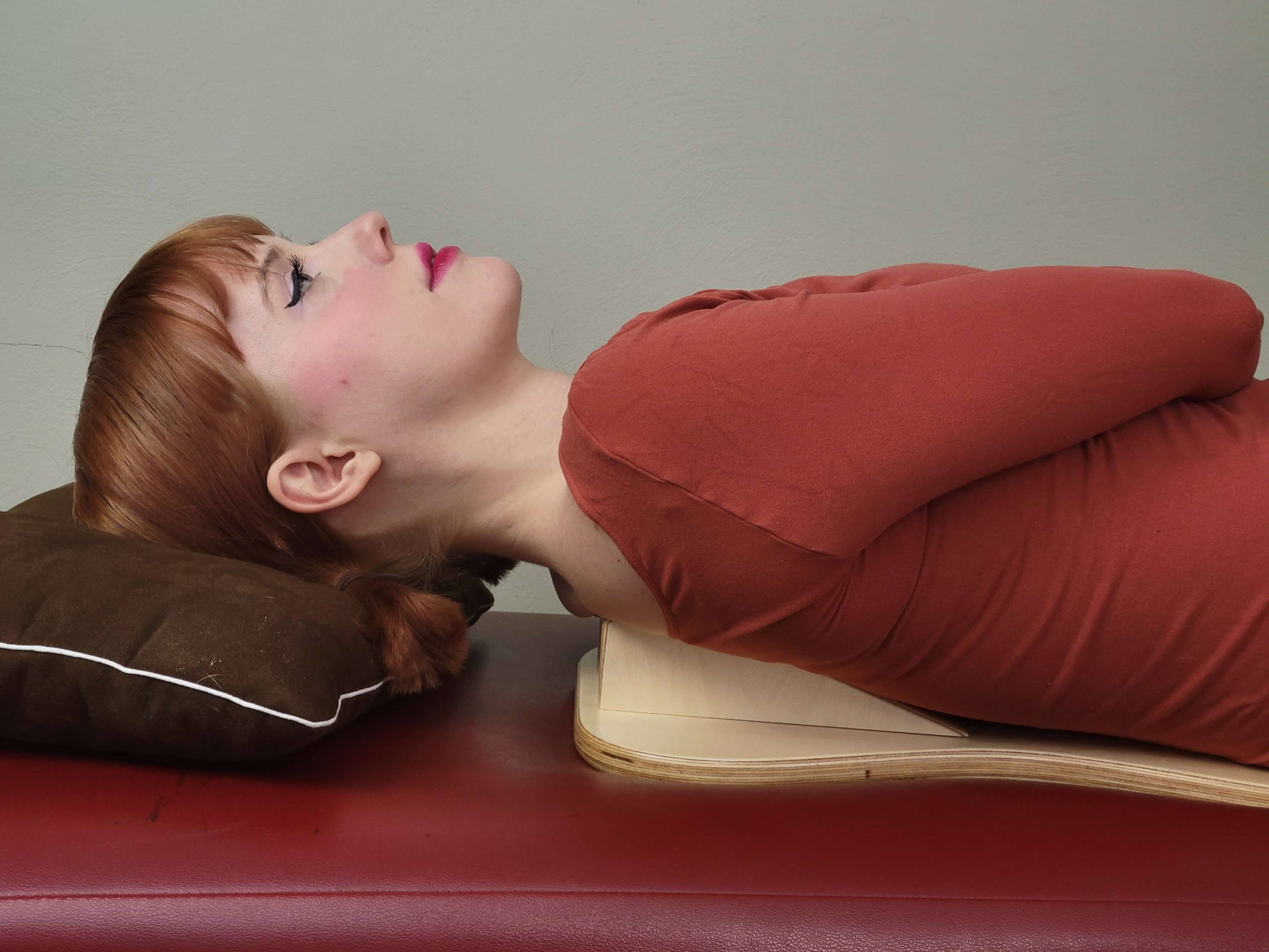 woman laying on PurePosture board