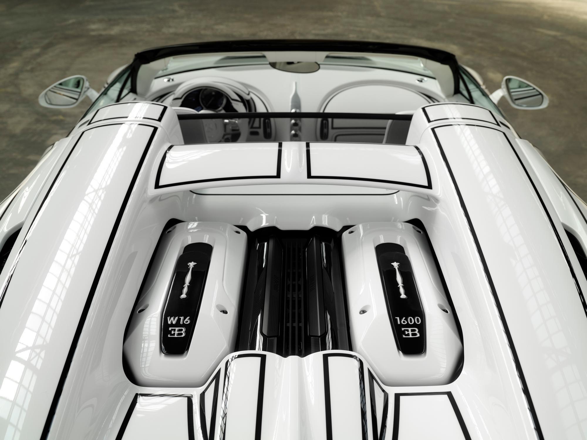 Top view of a sleek white sports car's engine.