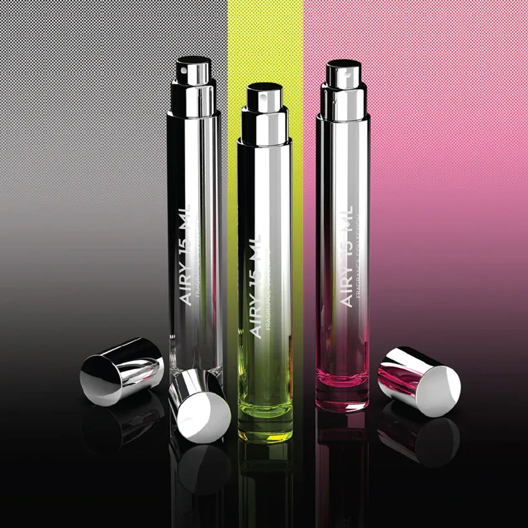 Three sleek perfume bottles with metallic finishes on a gradient background.