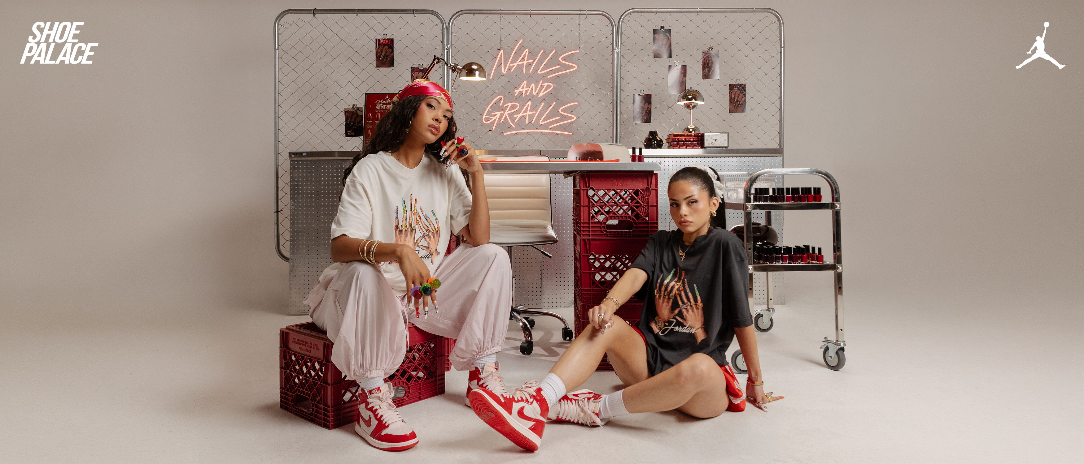 Two women posing in stylish outfits with red sneakers and accessories.