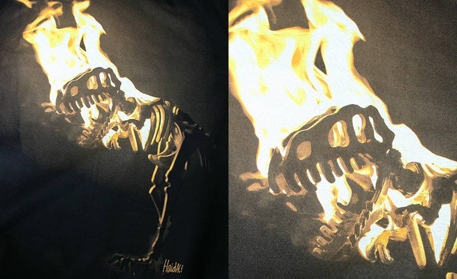An index screen print of a photograph of a wooden dinosaur skeleton set on fire. The dinosaur is facing left with bright glowing bright white and yellow flames coming off the skull, and creating dramatic backlit lighting effect on the dinosaur's upper body silhouette 