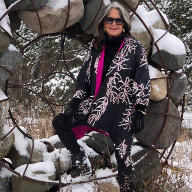 Connee Mayeron Cowles wearing pink black and white reversible silk jacket at her farm by Ala von Auersperg