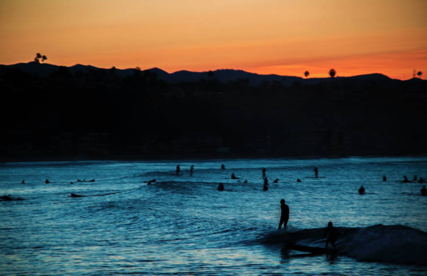 Doheney State Beach Park in Dana Point California at sunset with surfers